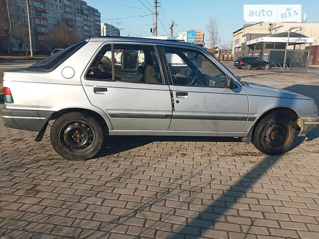 Сірий Пежо 309, об'ємом двигуна 1.9 л та пробігом 177 тис. км за 1350 $, фото 1 на Automoto.ua