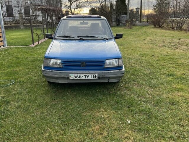 Синий Пежо 309, объемом двигателя 1.6 л и пробегом 350 тыс. км за 615 $, фото 1 на Automoto.ua
