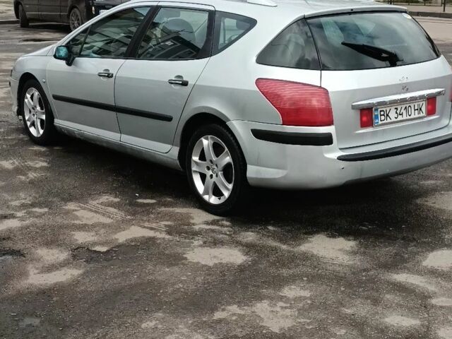 Серый Пежо 407, объемом двигателя 2 л и пробегом 322 тыс. км за 4200 $, фото 1 на Automoto.ua