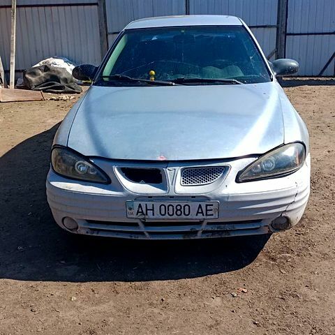 Сірий Понтіак Гранд АМ, об'ємом двигуна 2.2 л та пробігом 250 тис. км за 800 $, фото 1 на Automoto.ua