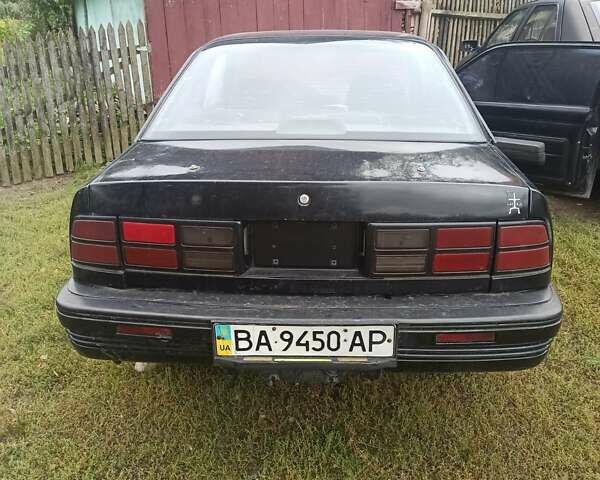 Черный Понтиак Санберд, объемом двигателя 2 л и пробегом 120 тыс. км за 450 $, фото 1 на Automoto.ua