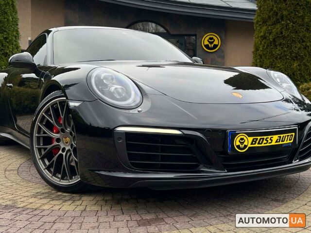 Черный Порше 911 Каррера, объемом двигателя 3 л и пробегом 55 тыс. км за 93900 $, фото 1 на Automoto.ua