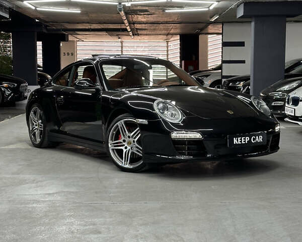 Черный Порше 911, объемом двигателя 3.8 л и пробегом 49 тыс. км за 75000 $, фото 1 на Automoto.ua