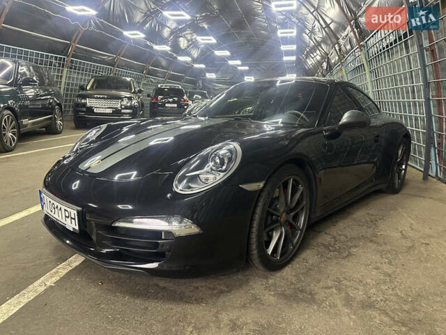 Черный Порше 911, объемом двигателя 3.8 л и пробегом 53 тыс. км за 82000 $, фото 1 на Automoto.ua