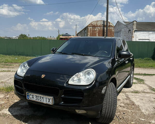 Черный Порше Каен, объемом двигателя 4.51 л и пробегом 376 тыс. км за 5600 $, фото 1 на Automoto.ua