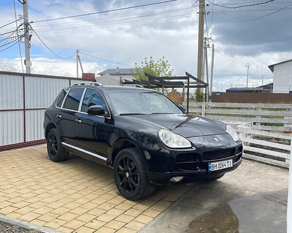 Черный Порше Каен, объемом двигателя 3.2 л и пробегом 300 тыс. км за 7800 $, фото 1 на Automoto.ua