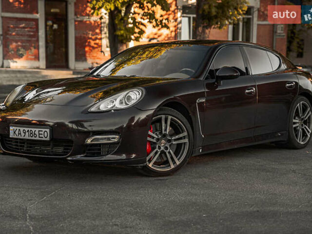 Красный Порше Панамера, объемом двигателя 4.81 л и пробегом 153 тыс. км за 25555 $, фото 1 на Automoto.ua