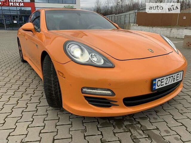 Оранжевый Порше Панамера, объемом двигателя 3.6 л и пробегом 280 тыс. км за 34444 $, фото 1 на Automoto.ua