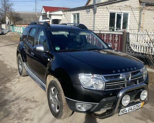 Черный Рено Дастер, объемом двигателя 1.6 л и пробегом 200 тыс. км за 9400 $, фото 1 на Automoto.ua