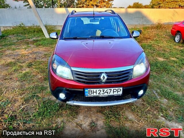 Красный Рено Сандеро, объемом двигателя 1.6 л и пробегом 255 тыс. км за 4400 $, фото 1 на Automoto.ua