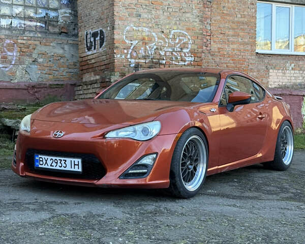 Оранжевый Сцион FR-S, объемом двигателя 2 л и пробегом 160 тыс. км за 14300 $, фото 1 на Automoto.ua