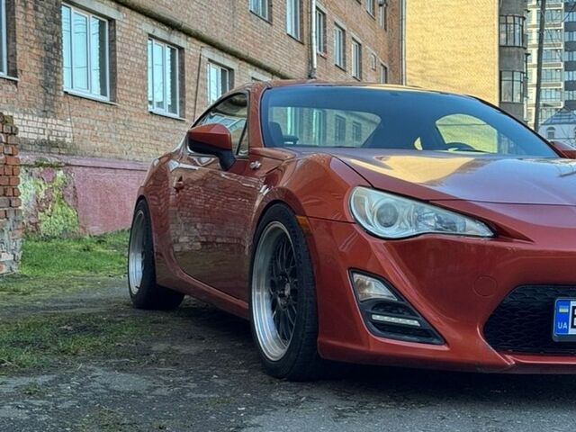 Оранжевый Сцион FR-S, объемом двигателя 2 л и пробегом 160 тыс. км за 14000 $, фото 1 на Automoto.ua