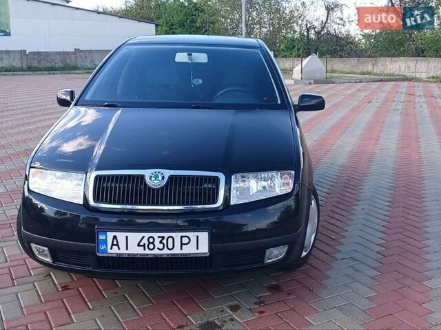Черный Шкода Фабия, объемом двигателя 1.39 л и пробегом 205 тыс. км за 3500 $, фото 1 на Automoto.ua