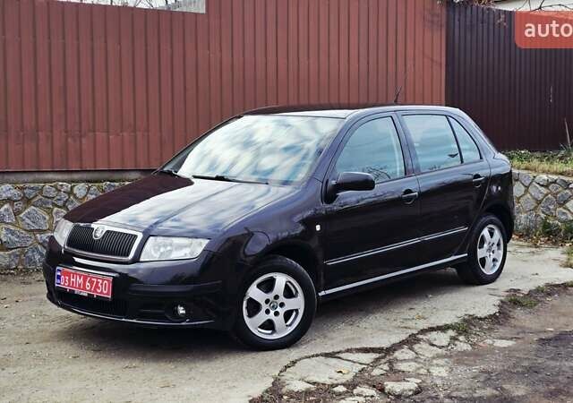 Черный Шкода Фабия, объемом двигателя 1.39 л и пробегом 173 тыс. км за 5799 $, фото 1 на Automoto.ua