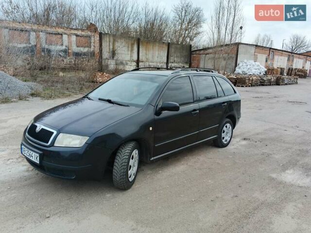 Черный Шкода Фабия, объемом двигателя 1.39 л и пробегом 229 тыс. км за 4350 $, фото 1 на Automoto.ua