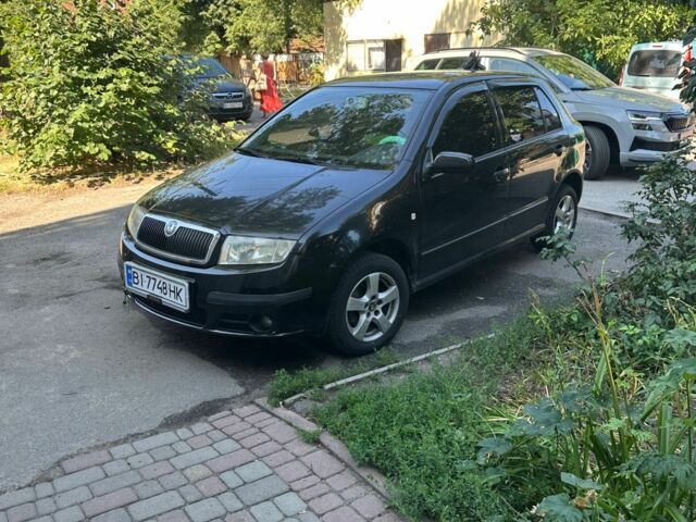 Черный Шкода Фабия, объемом двигателя 1.4 л и пробегом 245 тыс. км за 4000 $, фото 1 на Automoto.ua