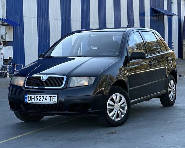 Черный Шкода Фабия, объемом двигателя 1.2 л и пробегом 220 тыс. км за 2999 $, фото 1 на Automoto.ua