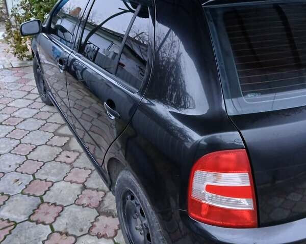 Черный Шкода Фабия, объемом двигателя 1.2 л и пробегом 313 тыс. км за 2700 $, фото 1 на Automoto.ua