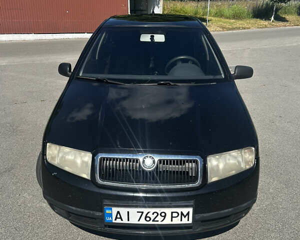 Черный Шкода Фабия, объемом двигателя 1.2 л и пробегом 366 тыс. км за 3500 $, фото 1 на Automoto.ua