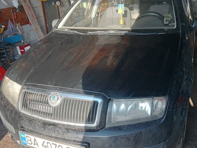 Черный Шкода Фабия, объемом двигателя 1.2 л и пробегом 285 тыс. км за 2300 $, фото 1 на Automoto.ua