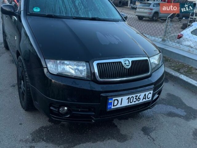 Черный Шкода Фабия, объемом двигателя 1.2 л и пробегом 278 тыс. км за 3300 $, фото 1 на Automoto.ua