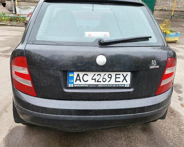 Черный Шкода Фабия, объемом двигателя 1.2 л и пробегом 341 тыс. км за 3000 $, фото 1 на Automoto.ua