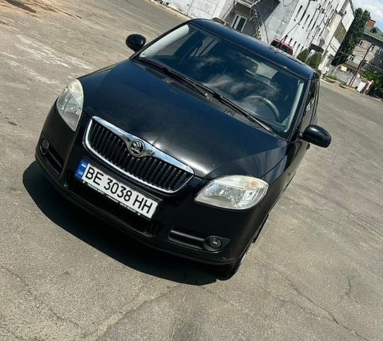 Черный Шкода Фабия, объемом двигателя 1.39 л и пробегом 211 тыс. км за 4100 $, фото 1 на Automoto.ua