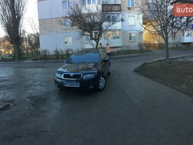 Черный Шкода Фабия, объемом двигателя 1.4 л и пробегом 203 тыс. км за 4100 $, фото 1 на Automoto.ua