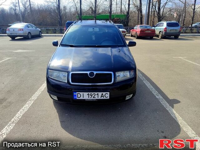 Черный Шкода Фабия, объемом двигателя 1.4 л и пробегом 299 тыс. км за 4100 $, фото 1 на Automoto.ua