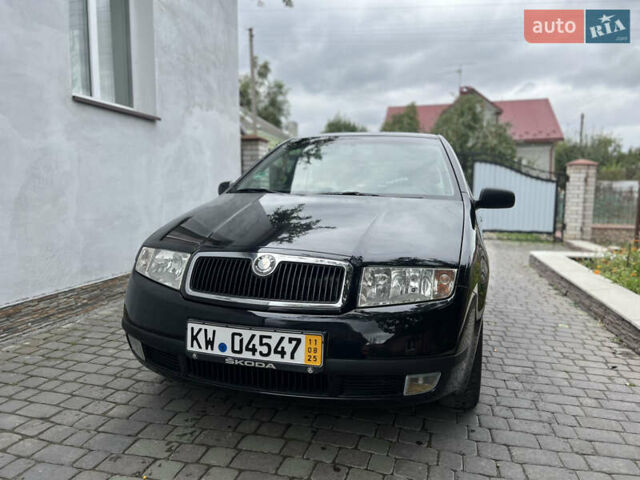 Черный Шкода Фабия, объемом двигателя 1.39 л и пробегом 174 тыс. км за 4999 $, фото 1 на Automoto.ua