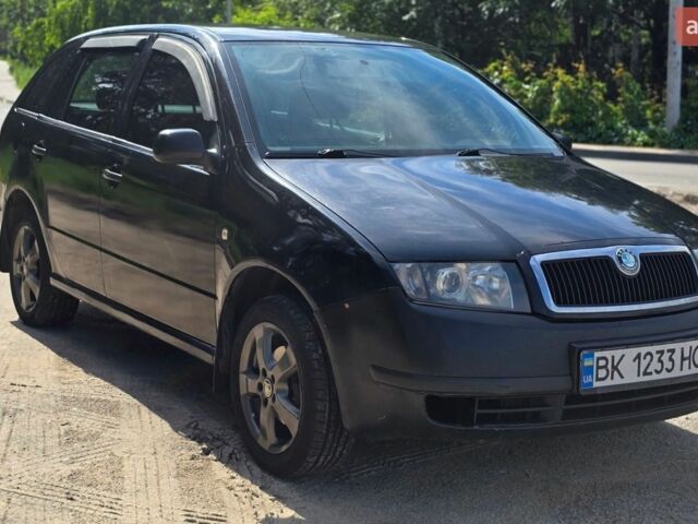 Черный Шкода Фабия, объемом двигателя 1.4 л и пробегом 348 тыс. км за 3200 $, фото 1 на Automoto.ua