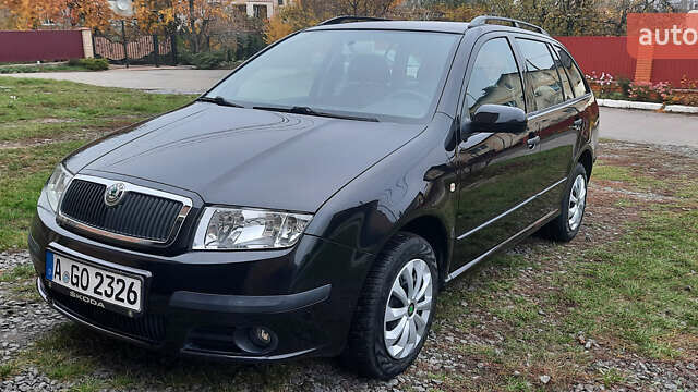 Черный Шкода Фабия, объемом двигателя 1.39 л и пробегом 168 тыс. км за 4600 $, фото 1 на Automoto.ua