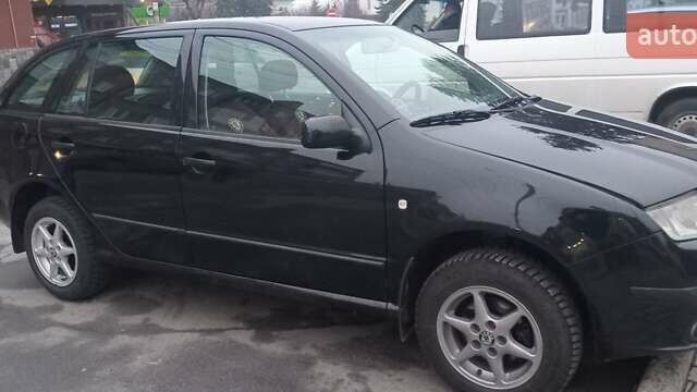 Черный Шкода Фабия, объемом двигателя 1.4 л и пробегом 293 тыс. км за 3850 $, фото 1 на Automoto.ua