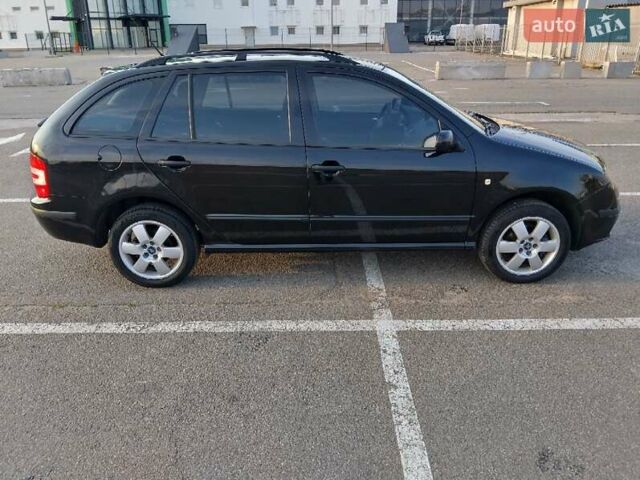 Черный Шкода Фабия, объемом двигателя 1.39 л и пробегом 240 тыс. км за 5000 $, фото 1 на Automoto.ua
