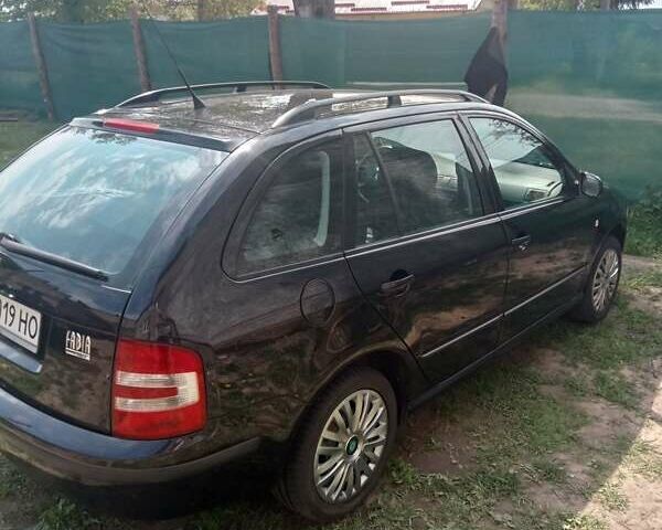 Черный Шкода Фабия, объемом двигателя 1.39 л и пробегом 168 тыс. км за 5200 $, фото 1 на Automoto.ua