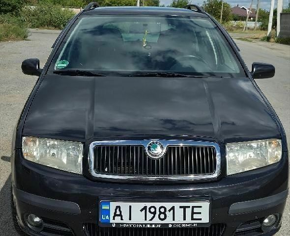 Черный Шкода Фабия, объемом двигателя 1.39 л и пробегом 235 тыс. км за 3800 $, фото 1 на Automoto.ua