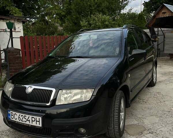 Черный Шкода Фабия, объемом двигателя 1.39 л и пробегом 220 тыс. км за 4650 $, фото 1 на Automoto.ua