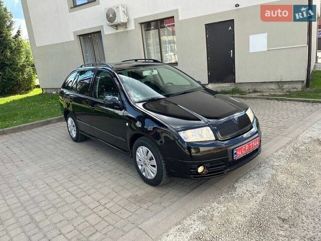 Черный Шкода Фабия, объемом двигателя 1.4 л и пробегом 190 тыс. км за 4699 $, фото 1 на Automoto.ua