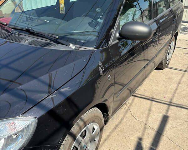 Черный Шкода Фабия, объемом двигателя 1.4 л и пробегом 215 тыс. км за 5300 $, фото 1 на Automoto.ua