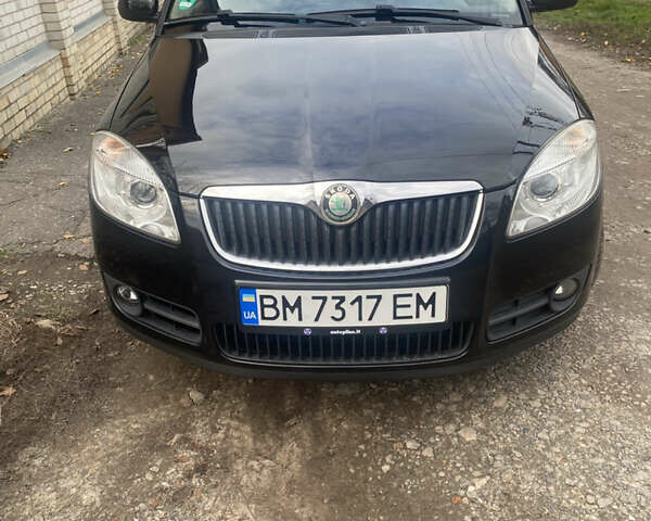 Черный Шкода Фабия, объемом двигателя 1.6 л и пробегом 172 тыс. км за 5950 $, фото 1 на Automoto.ua