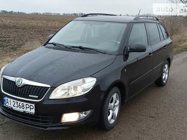 Черный Шкода Фабия, объемом двигателя 1.2 л и пробегом 276 тыс. км за 6500 $, фото 1 на Automoto.ua