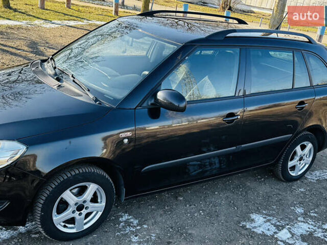 Черный Шкода Фабия, объемом двигателя 1.2 л и пробегом 215 тыс. км за 4999 $, фото 1 на Automoto.ua