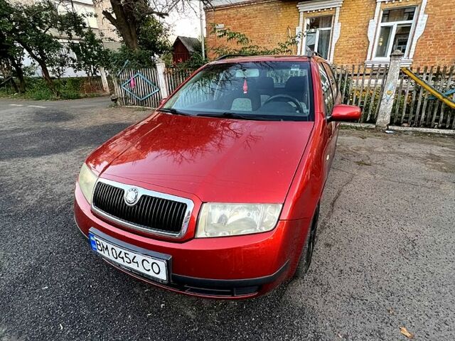 Красный Шкода Фабия, объемом двигателя 1.4 л и пробегом 247 тыс. км за 4200 $, фото 1 на Automoto.ua