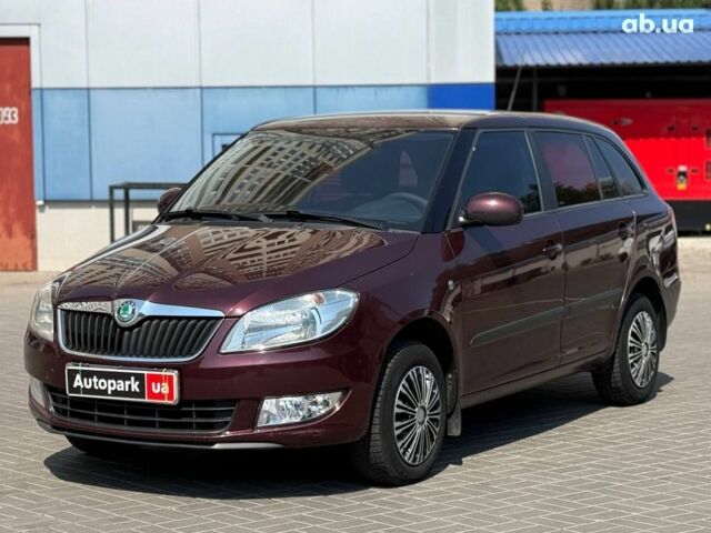 Красный Шкода Фабия, объемом двигателя 1.4 л и пробегом 164 тыс. км за 6640 $, фото 1 на Automoto.ua
