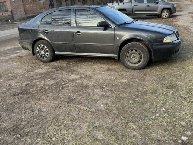 Черный Шкода Октавия, объемом двигателя 1.6 л и пробегом 395 тыс. км за 3600 $, фото 1 на Automoto.ua