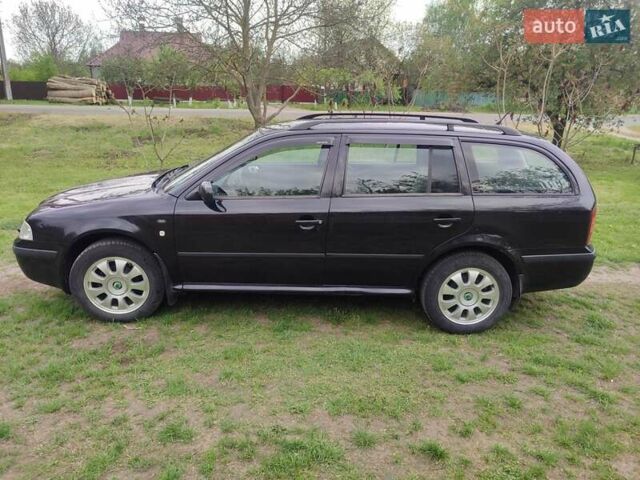 Черный Шкода Октавия, объемом двигателя 1.6 л и пробегом 185 тыс. км за 5000 $, фото 1 на Automoto.ua