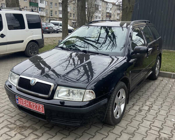Черный Шкода Октавия, объемом двигателя 1.6 л и пробегом 210 тыс. км за 5600 $, фото 1 на Automoto.ua