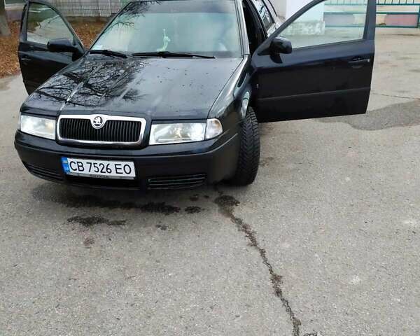 Черный Шкода Октавия, объемом двигателя 1.6 л и пробегом 255 тыс. км за 5300 $, фото 1 на Automoto.ua