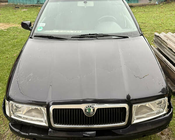 Черный Шкода Октавия, объемом двигателя 2 л и пробегом 320 тыс. км за 3500 $, фото 1 на Automoto.ua