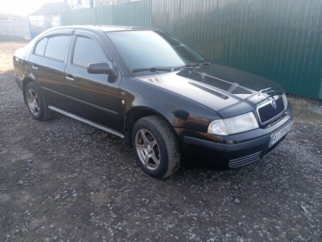 Черный Шкода Октавия, объемом двигателя 1.8 л и пробегом 335 тыс. км за 4500 $, фото 1 на Automoto.ua